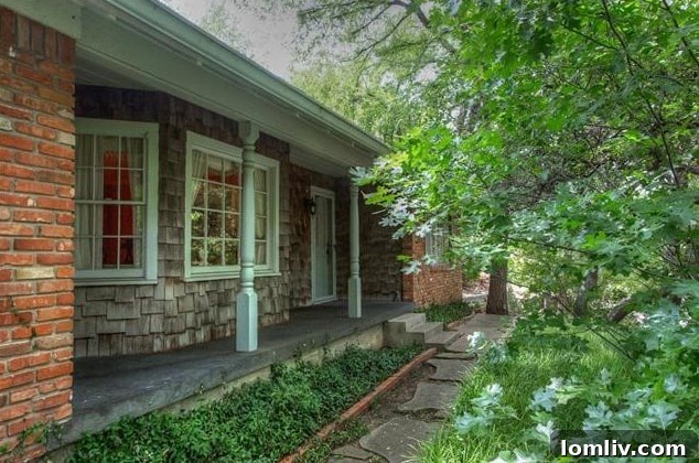 Detailed view of the charming shingle siding and antique brick facade of 208 Rockwood Drive, highlighting its classic aesthetic.