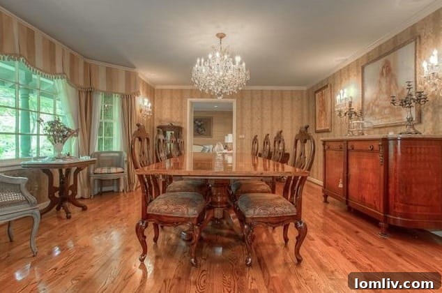 Spacious and elegant dining room with polished light hardwood floors at 208 Rockwood Drive, perfect for entertaining.