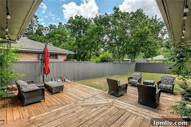 Spacious backyard deck overlooking a greenbelt at 11635 Cimarec Street