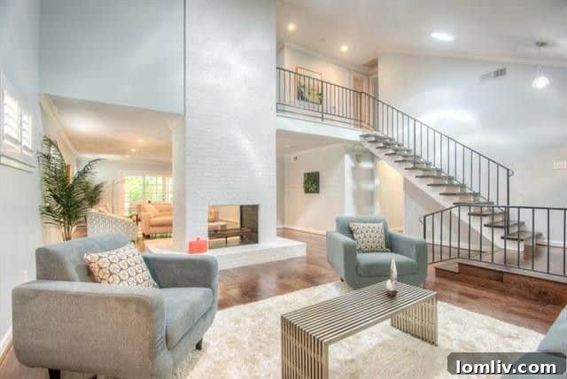Two Lochwood Homes: A Splurge and a Steal, Both with New Lower Prices 4 Contemporary kitchen with quartz countertops and white shaker cabinets at 10542 Wyatt Street