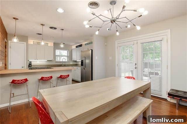 Two Lochwood Homes: A Splurge and a Steal, Both with New Lower Prices 10 Updated kitchen with granite and butcher block countertops at 11635 Cimarec Street