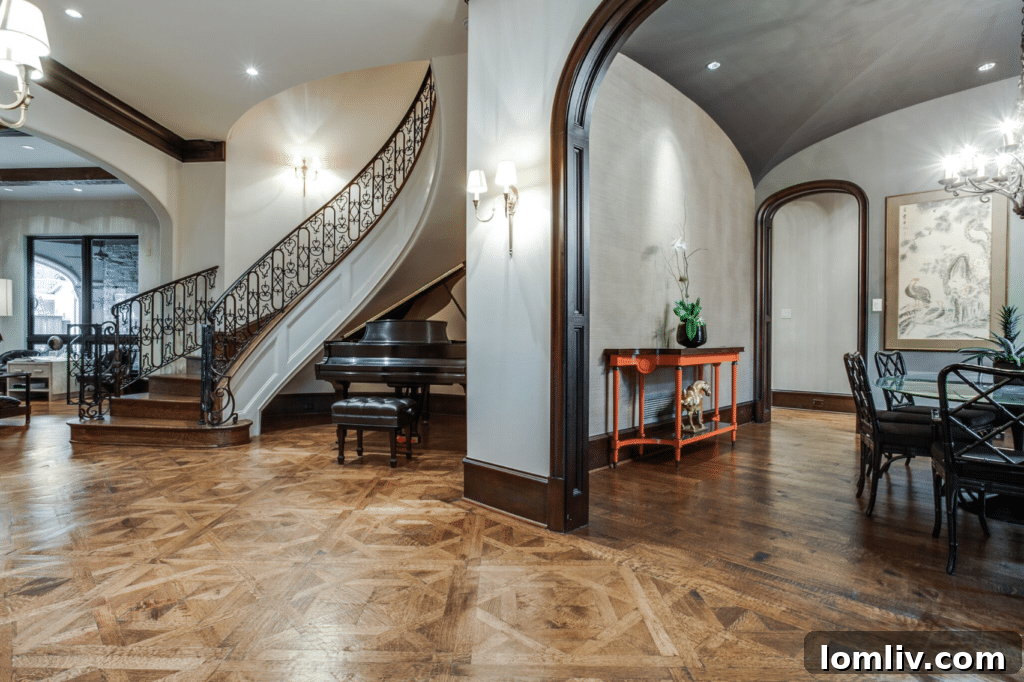 Gracefully curving staircase making a grand statement in the foyer