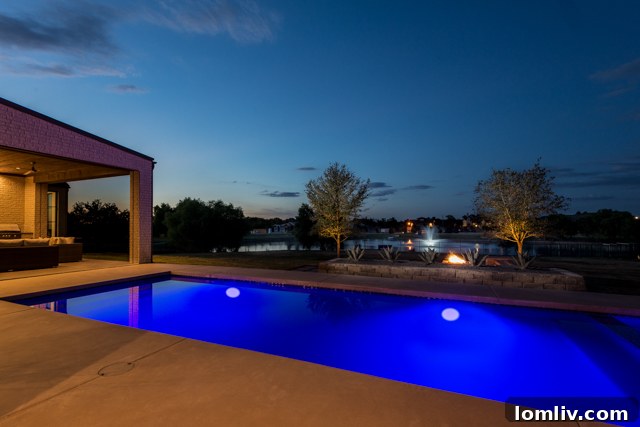 Stunning Pool with Water Features and Lakeside Views