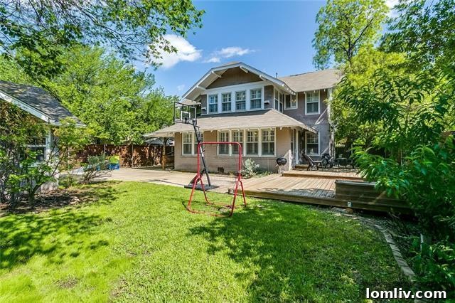 Rear View of Two-Story Home and Deck