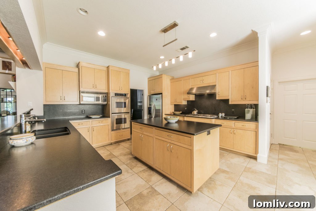 Modern open kitchen with abundant counter space and great views