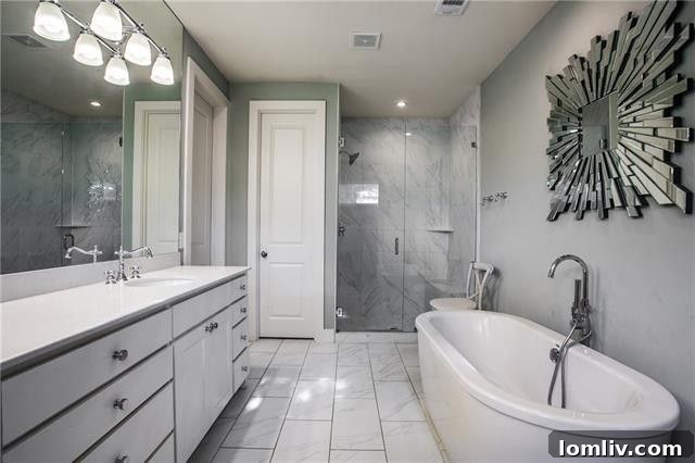 Spacious master bedroom with hardwood floors and ample light