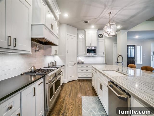 Modern kitchen with large quartzite island and Monogram appliances