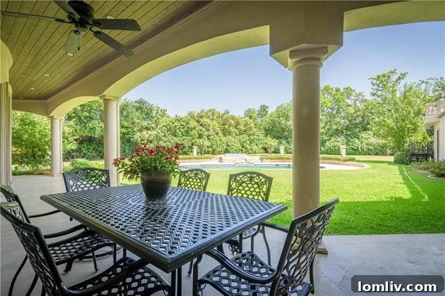 Over one acre of meticulously designed, resort-inspired landscaping surrounds the property, featuring a stunning swimming pool, a luxurious hot tub, and expansive yard space. The patio is equipped with gas connections for an outdoor kitchen and includes a separate cabana bathroom for ultimate convenience.