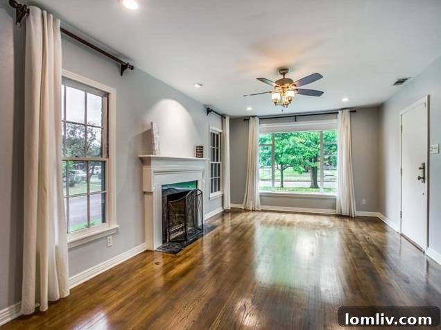 Spacious Formal Living Room with Fireplace and Wood Floors