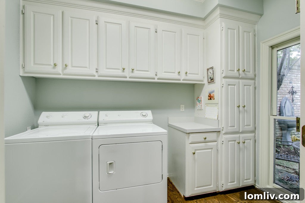 Laundry room with a scenic view of the lush backyard, making chores more pleasant