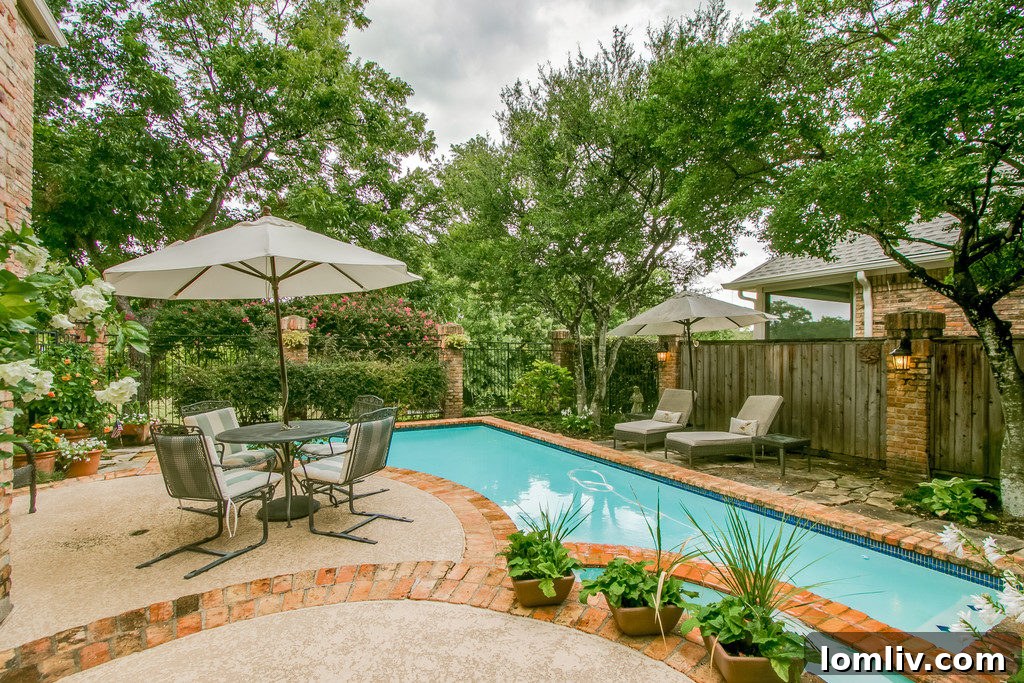 The lush greenbelt behind the home, offering privacy and natural beauty