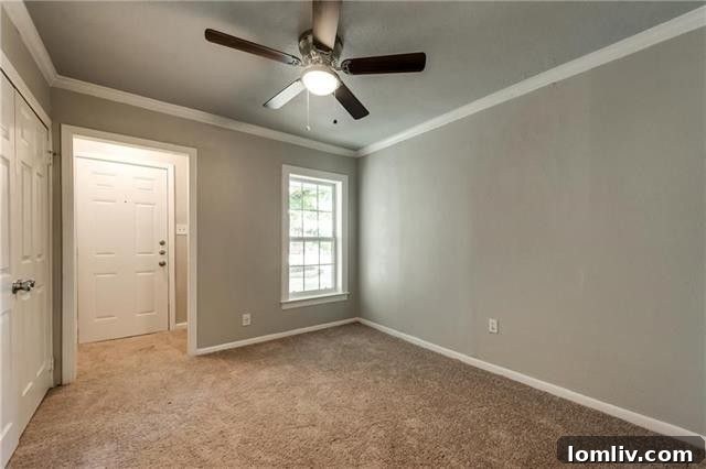 Hallway with laminate flooring leading to bedrooms