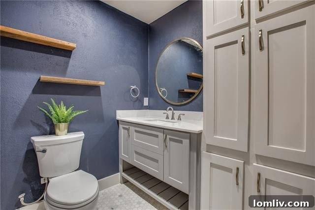 Stunning walk-in glass shower with designer tiles in the master bathroom