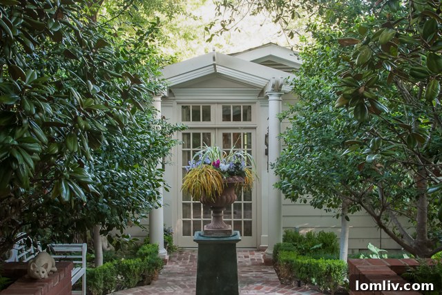Lush gardens leading to the private guest home at 5516 Byers Avenue