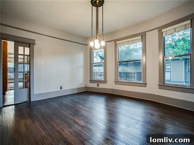 Diane Sherman Unveils Historic Winnetka Heights Craftsman Priced at 449000 12 Versatile Living Area with Bay Window and Pocket Doors