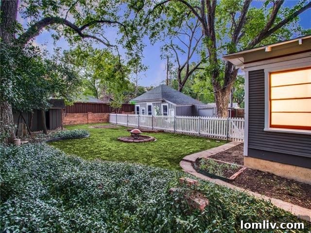 Diane Sherman Unveils Historic Winnetka Heights Craftsman Priced at 449000 21 Lush Fenced Backyard with Mature Trees in Winnetka Heights