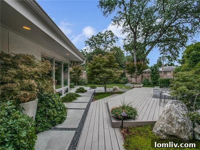 Dallas Open House Gems Await Your Discovery This Weekend 7 Tranquil backyard with concrete hardscaping and lush greenery at 7120 Fenton Drive