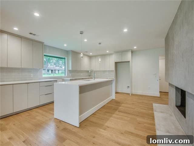 Dallas Open House Gems Await Your Discovery This Weekend 10 Contemporary kitchen with quartz countertops and island at 3911 Antigua Drive