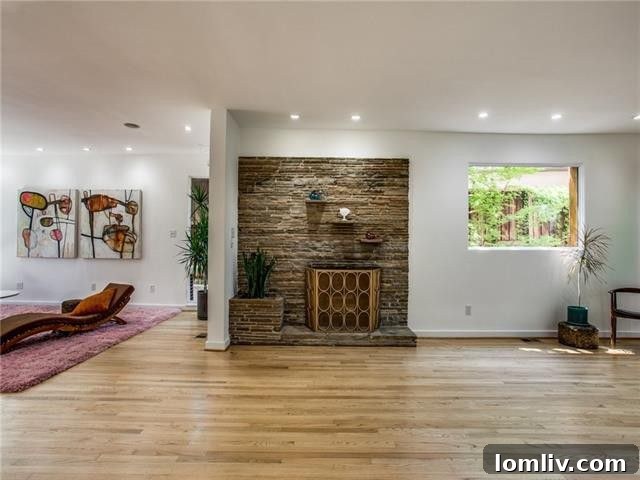 Spacious living room with red oak floors and ample natural light