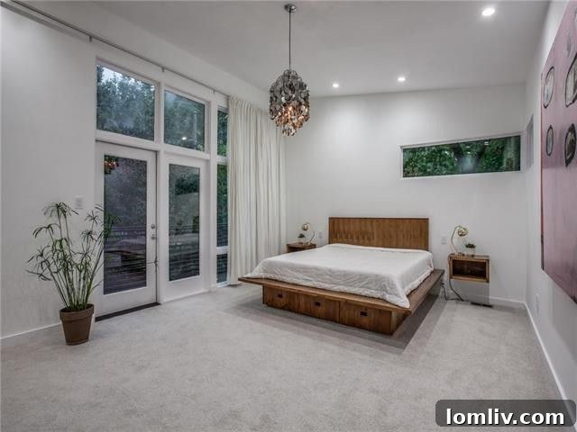 Luxurious master bedroom with high ceilings and French doors