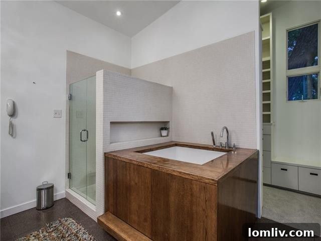 Dual sinks and custom cabinetry in the master en suite