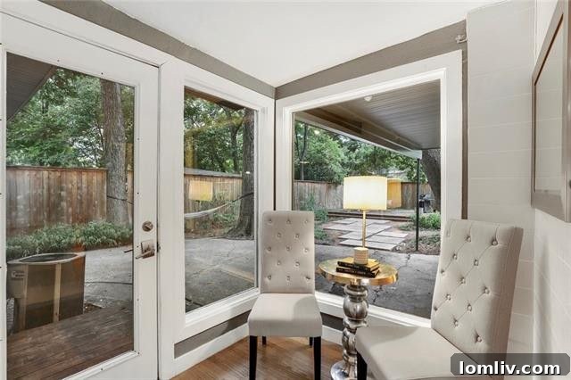 Treetop Midcentury Gem in Eastwood Estates: Incredible Value at $450K 13 Sunroom with Walls of Glass Overlooking Backyard