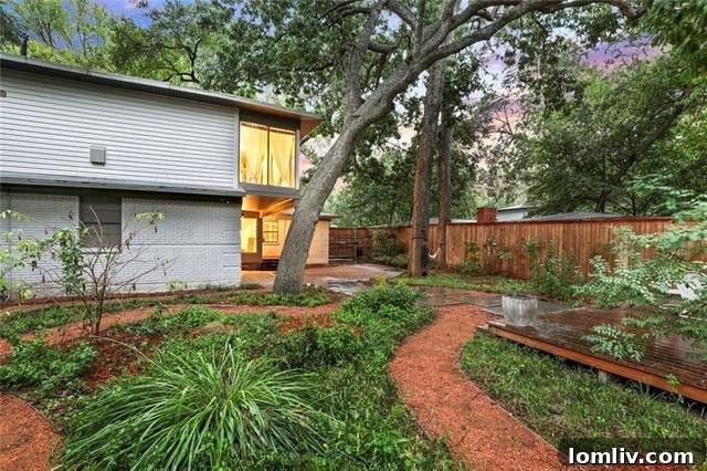 Treetop Midcentury Gem in Eastwood Estates: Incredible Value at $450K 15 Secluded Backyard with Pathways and Flowerbeds