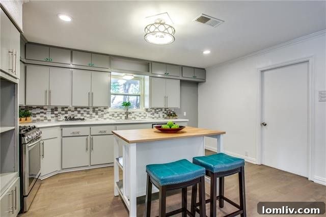 Sleek kitchen with quartz countertops and stainless steel appliances