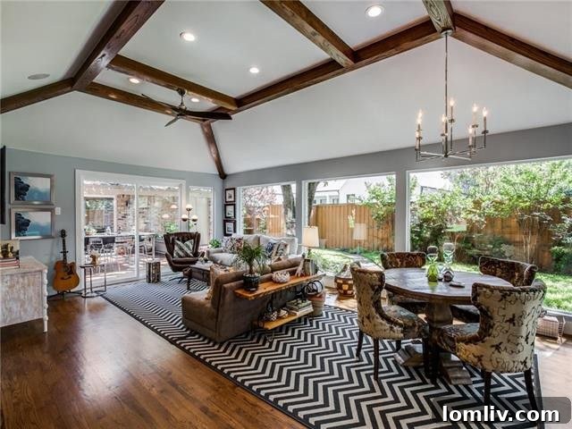 Spacious living room with beamed ceilings and modern fireplace at 5826 Melshire Drive