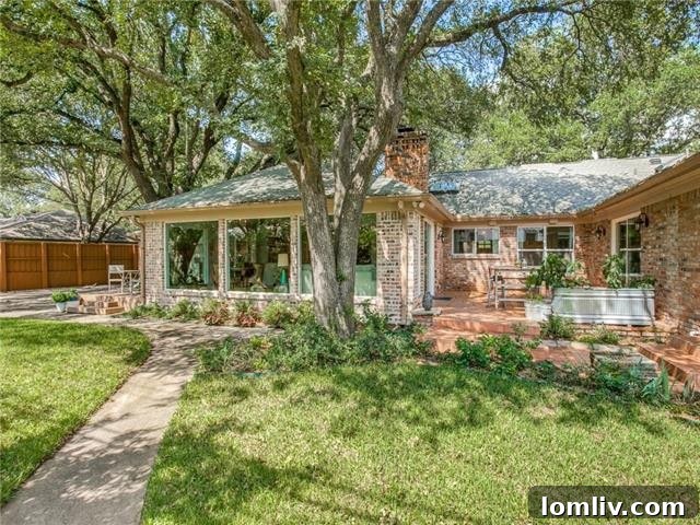 Discover Elegant Style and Grand Renovations at Dallas Open Houses This Week 7 Expansive backyard with multiple Trex decks and lush landscaping at 5826 Melshire Drive
