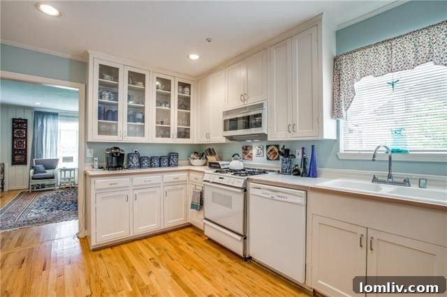 Bright kitchen with white Shaker-style cabinets at 5522 Stanford Avenue