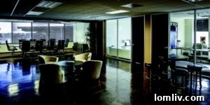 Modern co-working space common area with seating and natural light