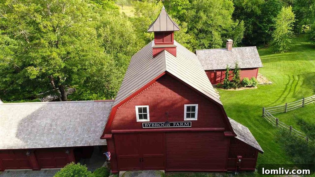 Scenic view of a historic Vermont property, Bybrook Farm, nestled in the picturesque landscape of Woodstock, Vermont, featuring natural beauty and charming architecture. Our 'Steal' property.