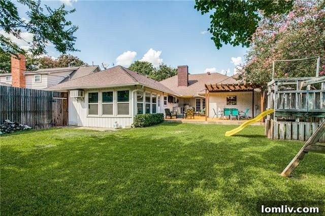 Sleek Style Takes Center Stage in Dallas Open Houses 17 Backyard with Pergola and Outdoor Kitchen Area