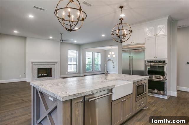 Gourmet kitchen with large island and breakfast bar in a Dallas luxury home.