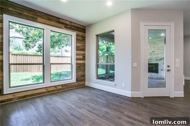 Modern breakfast area with a trendy wood plank accent wall.