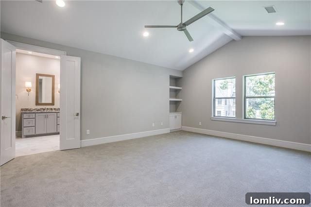 Master bedroom with vaulted ceiling and elegant design.