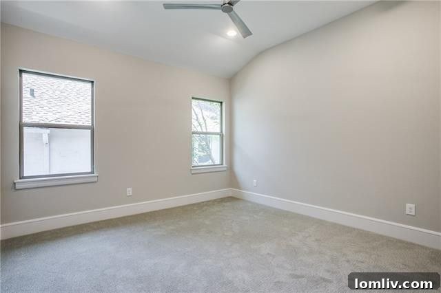 Another spacious secondary bedroom, demonstrating consistent luxury throughout.