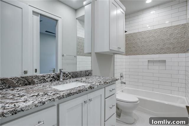 Luxurious secondary bathroom with high-end fixtures and custom details.