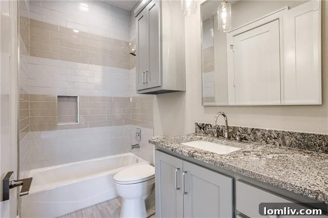Thoughtfully designed secondary bathroom with modern amenities.