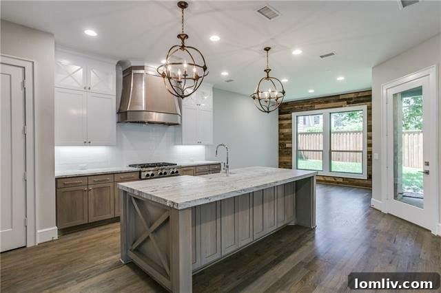 Luxury kitchen with double-height white custom cabinets and rich stained lower cabinets.