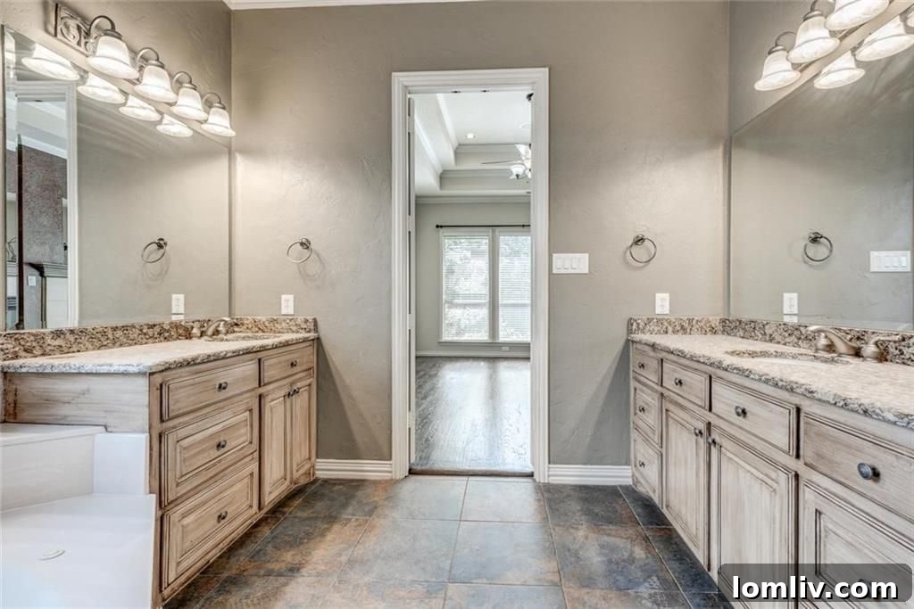 Master bath with dual vanities and ample drawers