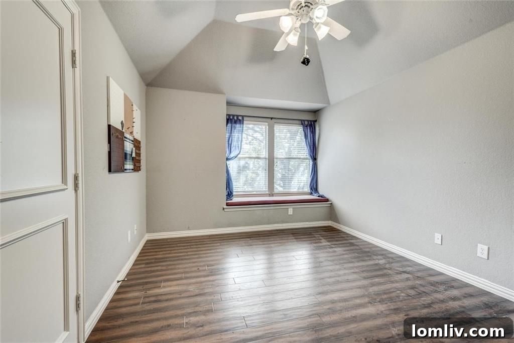 One of two upstairs bedrooms featuring a built-in window seat