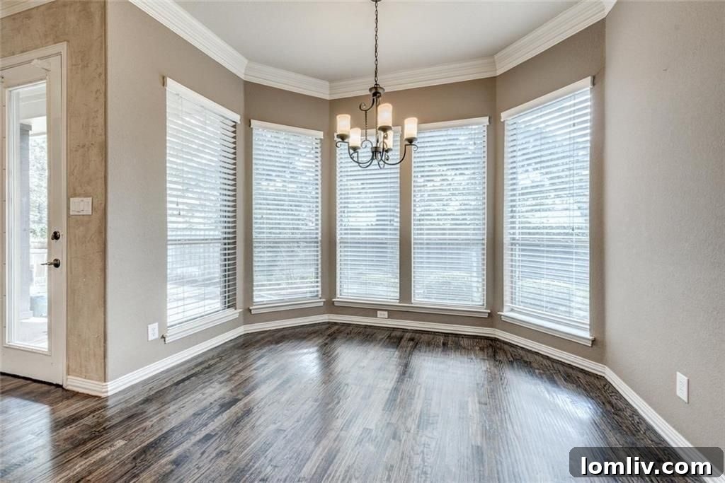 Breakfast nook with garden window overlooking backyard and living room