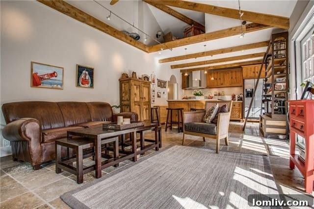 Spacious kitchen island with seating and open shelving.