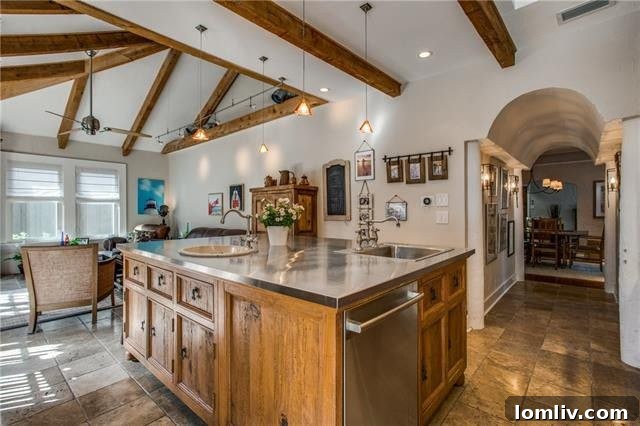 Gourmet kitchen and adjacent family room in the Dallas Tudor.