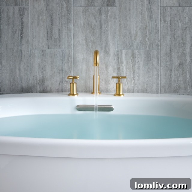 Luxurious master bathroom with high ceilings, contemporary fixtures, and abundant natural light.