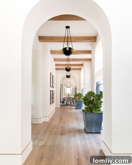 Exquisite contemporary kitchen with marble countertops, high-end appliances, and ample natural light.