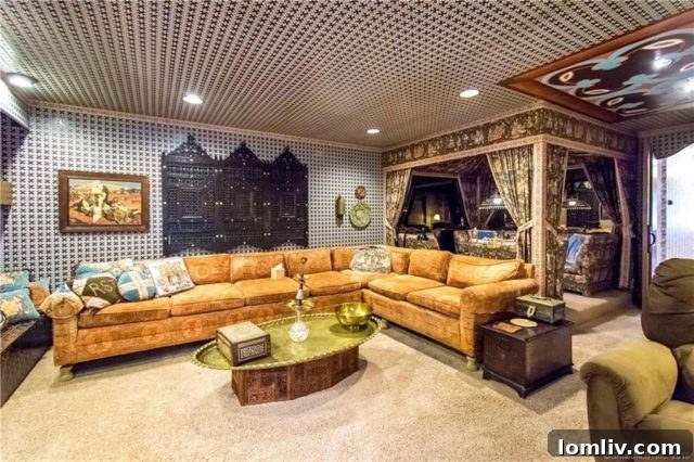 A recreational area or basement room with colorful, patterned carpeting, comfortable seating, and a casual 1970s ambiance, perfect for gatherings.