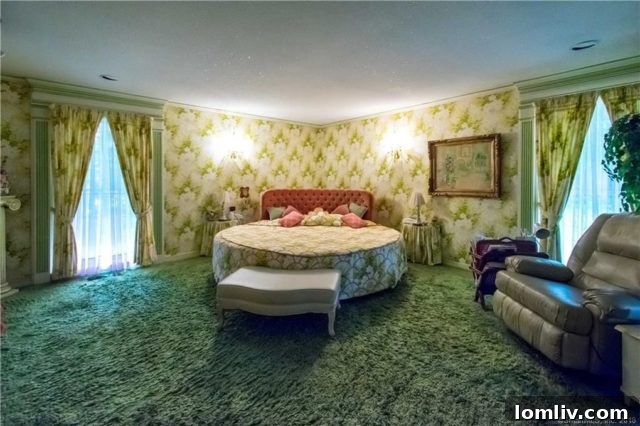 A themed bedroom from the 1970s with bold, repeating patterns on the wallpaper and bedding, creating a cohesive and immersive design.